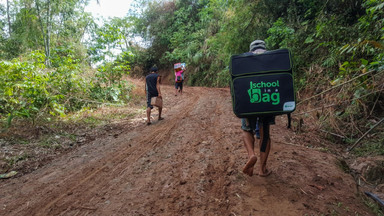 Mountain learners level up with Smart School-in-a-Bag <span class='pullquote'>Smart employees and locals of Maasin, Iloilo hike up a muddy trail for 1.5 hours to deliver digital learning tools to Trangka Elementary School.</span>
