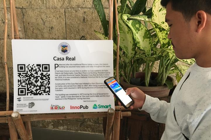 A mobile user scans the tourism QR code at Casa Real, Iloilo. Local tourism gets digital boost from Smart