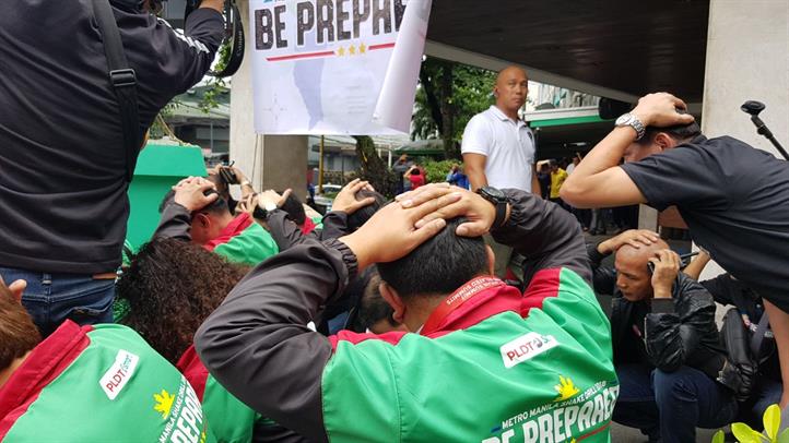 MMDA employees and other participants duck, cover, and hold during the #MMShakeDrill held at the MMDA HQ. Smart emergency communications boost MMDA quake drill