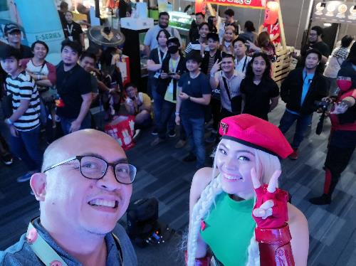 Smart DevNet senior developer evangelist Paul Pajo takes a selfie with cosplayers and attendees at GameCon after his talk. PLDT, Smart power GameCon 2019