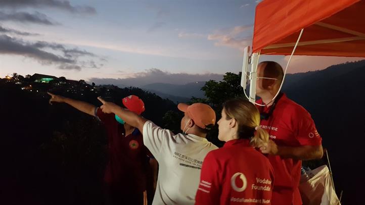 Vodafone volunteers get help from Itogon residents as they set up the free charging and Wi-Fi stations. Disaster preparedness, response in communities boosted via tech, partnerships