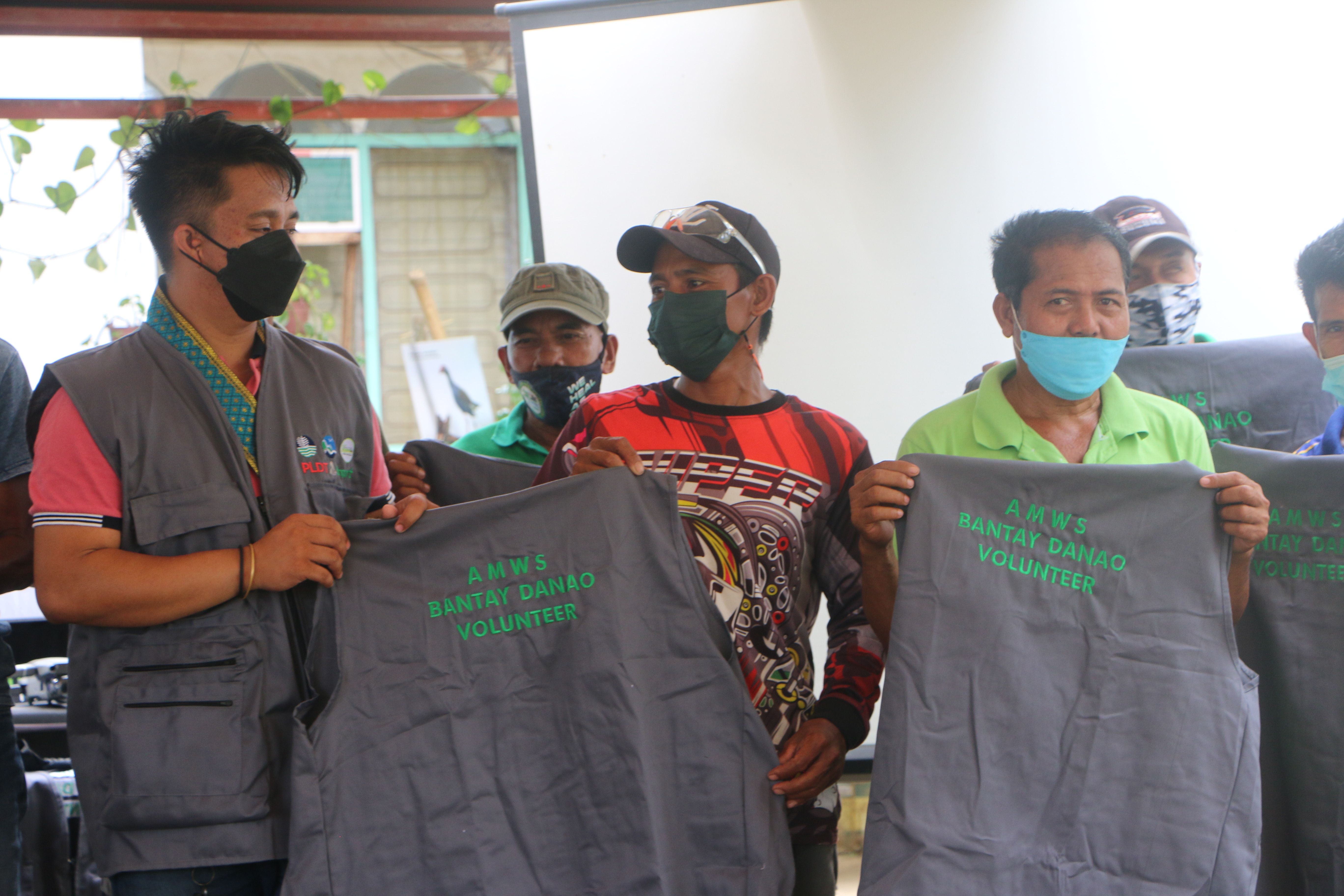 with sir John Deloso (Left side of photo) turning-over the vest to the Bantay Danao of AMWS